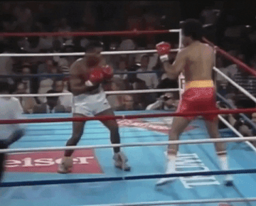 Tyson fake right, leaping left hook